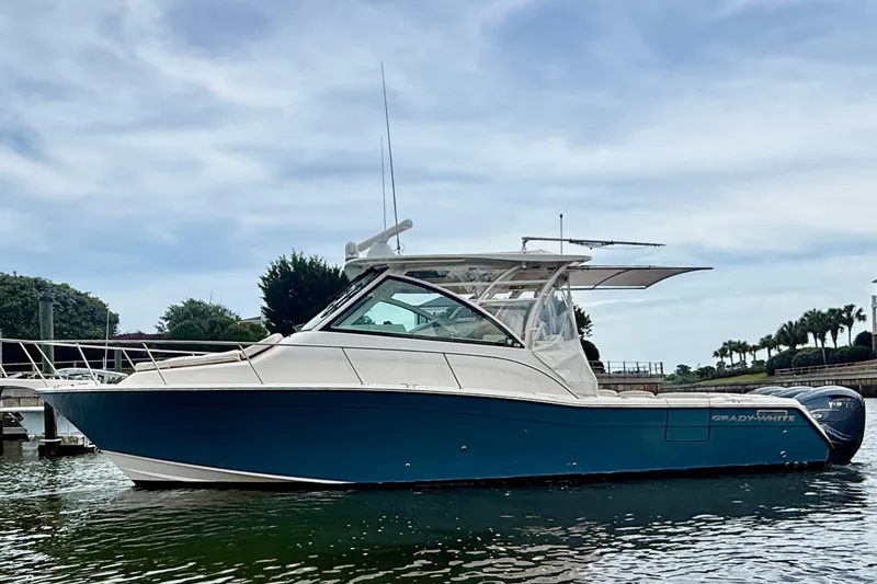 Slide: The Image of 2021 Grady-White Express 370 boat docked in a marina, side view. - 5