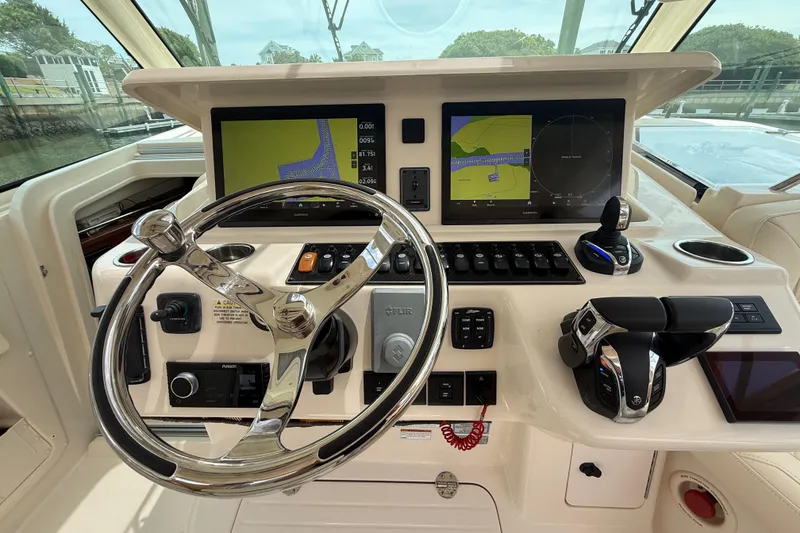 Slide: The Image of Helm of 2021 Grady-White Express 370 with advanced navigation displays and controls. - 8