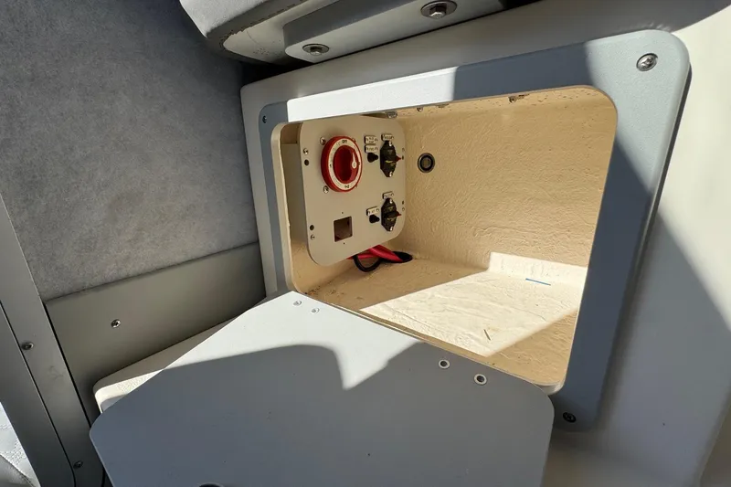 Slide: The Image of 2023 Defiance Admiral 220 EX boat compartment with electrical panel and wiring. - 25