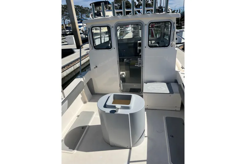 Slide: The Image of 2023 Defiance Admiral 220 EX boat interior with seating and storage compartments. - 4