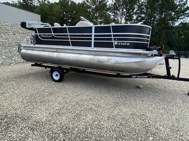 The Image of 2015 Starcraft Freedom 180 Tiller pontoon boat on trailer. - 1