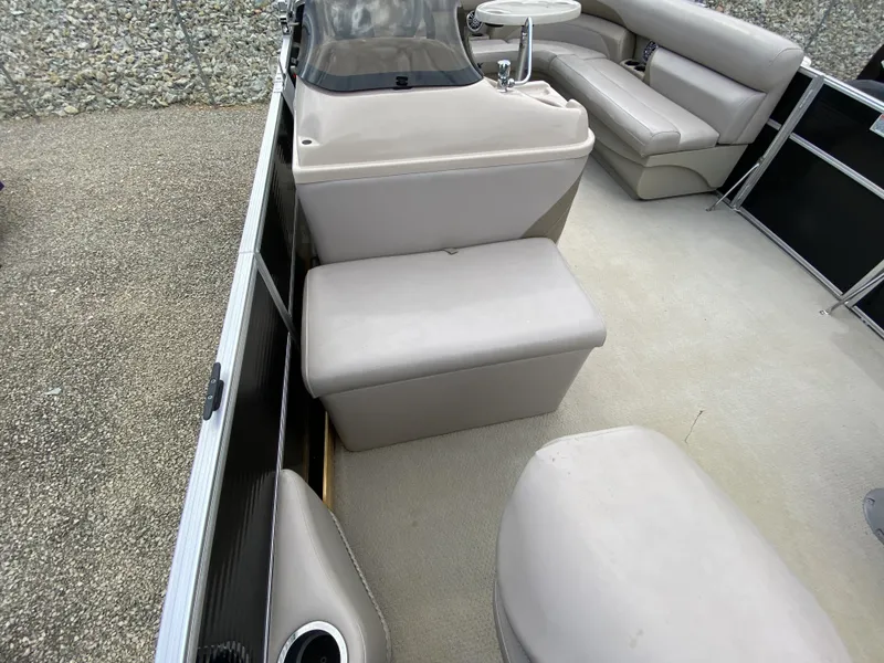 Slide: The Image of Interior of a 2015 Starcraft Freedom 180 Tiller boat, beige upholstery. - 11