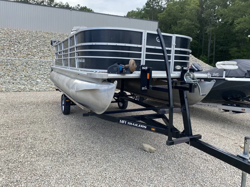 Slide: The Image of 2015 Starcraft Freedom 180 Tiller pontoon boat on trailer. - 4