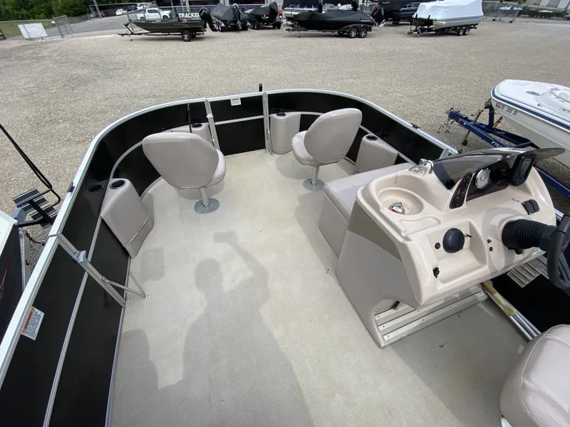 Slide: The Image of Interior of a 2015 Starcraft Freedom 180 Tiller boat with seating and helm console. - 8