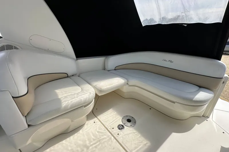 Slide: The Image of 2008 Sea Ray Sundancer 260 interior with white seating and table. - 13