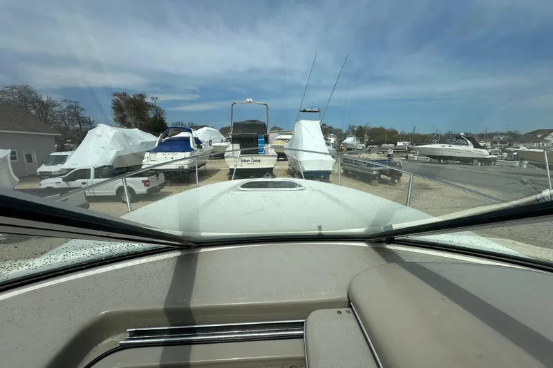 Slide: The Image of View from 2008 Sea Ray Sundancer 260, overlooking marina with boats and clear sky. - 15