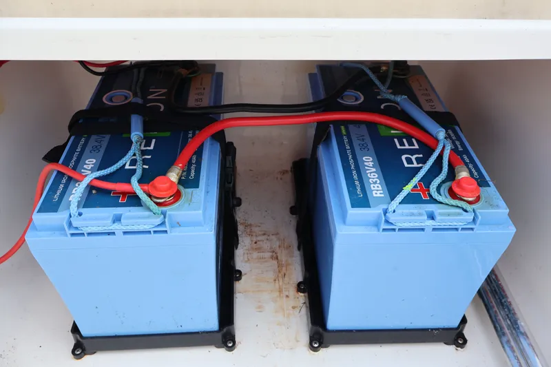 Slide: The Image of Two lithium-ion batteries in a 2023 Bulls Bay 2000 boat. - 12
