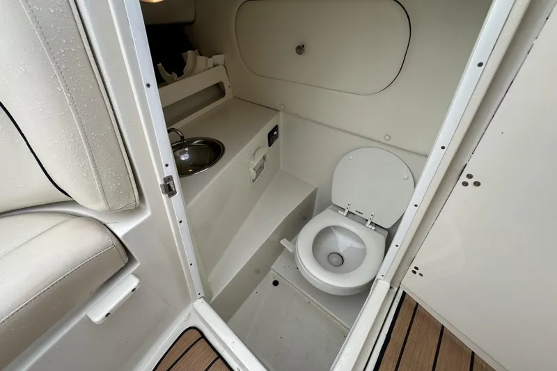 Slide: The Image of Compact bathroom in 2005 Chris-Craft Launch 28 boat with toilet and sink. - 14