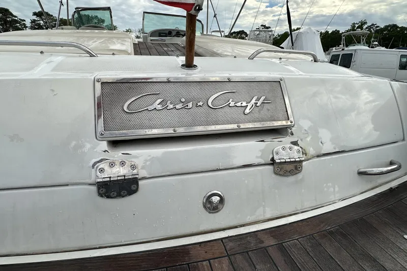 Slide: The Image of 2005 Chris-Craft Launch 28 boat stern with logo and metal fittings. - 20