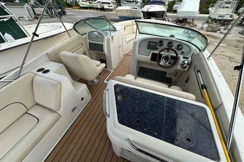 Slide: The Image of 2005 Chris-Craft Launch 28 boat interior with steering wheel and seating. - 4