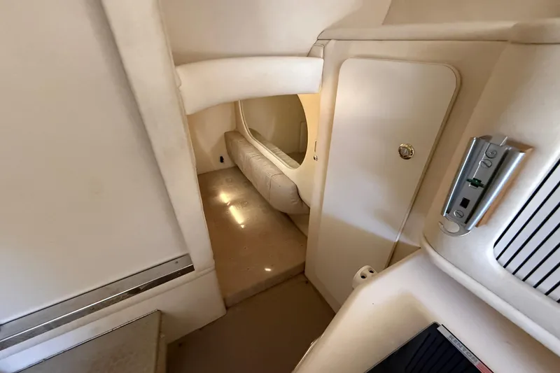 Slide: The Image of Interior cabin of 2002 Sea Ray Sundancer 260, featuring cozy seating and modern amenities. - 34