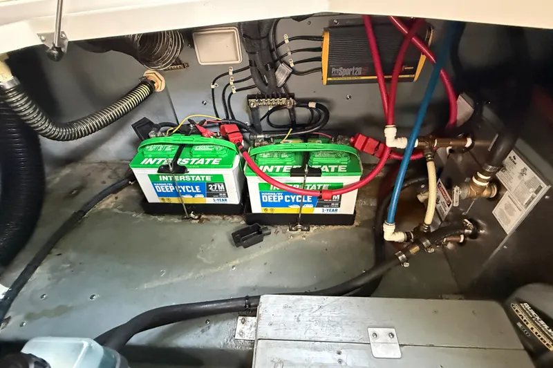 Slide: The Image of Battery compartment of a 2002 Sea Ray Sundancer 260 with Interstate deep cycle batteries. - 39