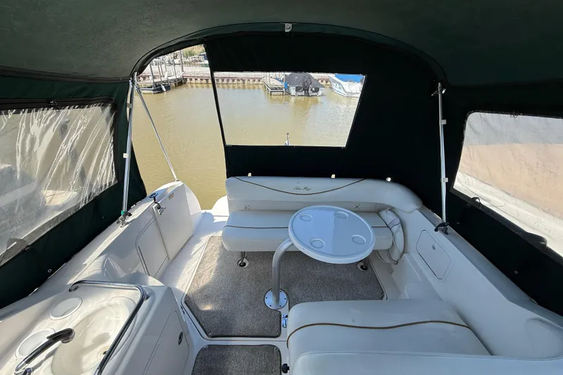 Slide: The Image of Interior view of 2002 Sea Ray Sundancer 260 boat with seating and table. - 4