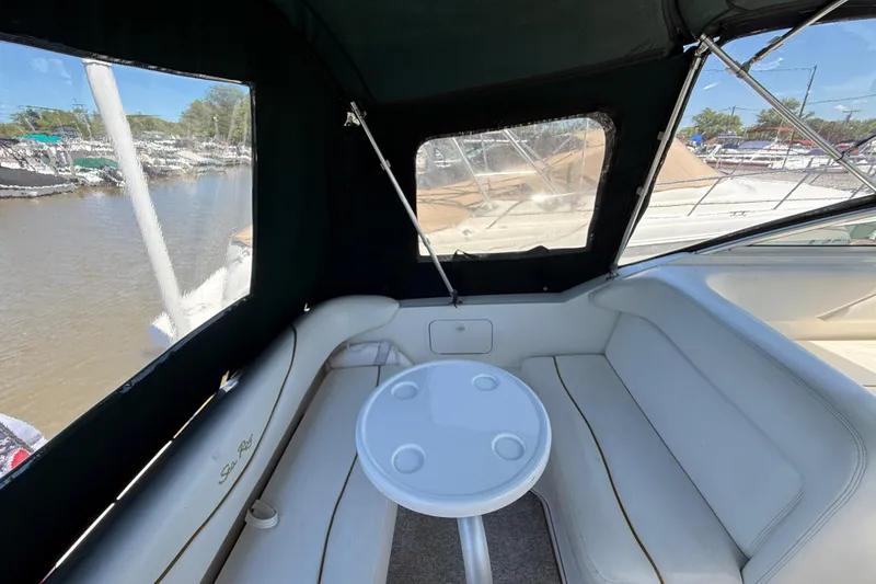 Slide: The Image of Interior view of 2002 Sea Ray Sundancer 260 boat with seating and table. - 6