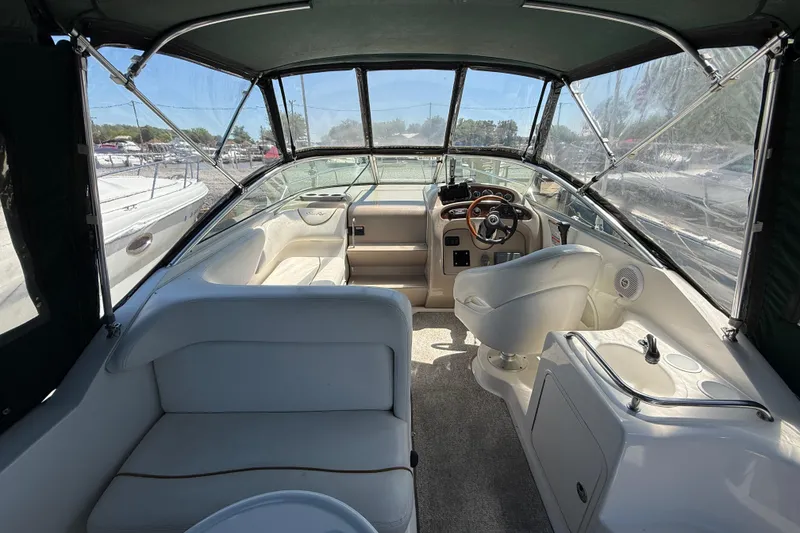 Slide: The Image of Interior of a 2002 Sea Ray Sundancer 260 boat with seating and helm. - 8
