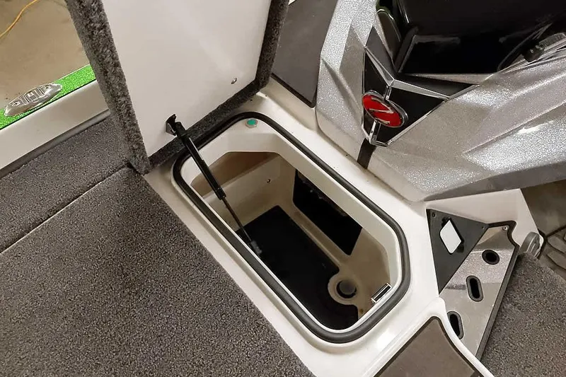 Slide: The Image of Open storage compartment in 2025 Ranger Z520R boat, featuring sleek design and durable materials. - 19