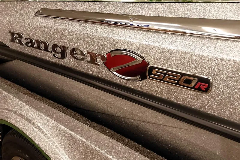 Slide: The Image of 2025 Ranger Z520R boat emblem on metallic surface. - 2
