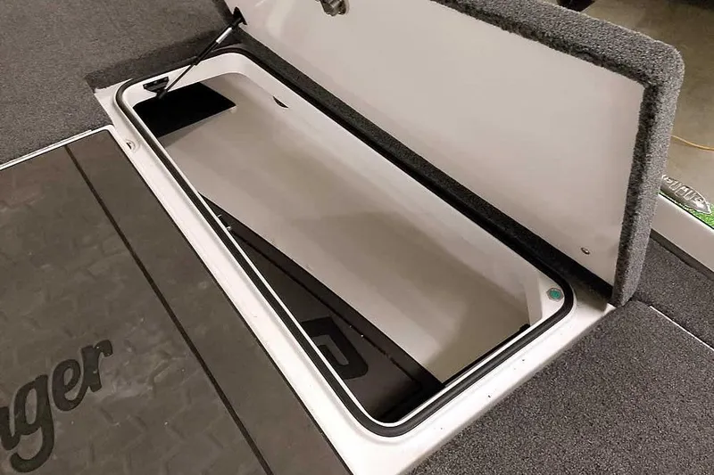 Slide: The Image of Open storage compartment in 2025 Ranger Z520R boat, showcasing spacious interior design. - 20