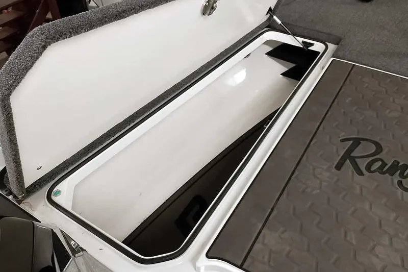 Slide: The Image of Open storage compartment on 2025 Ranger Z520R boat deck. - 21