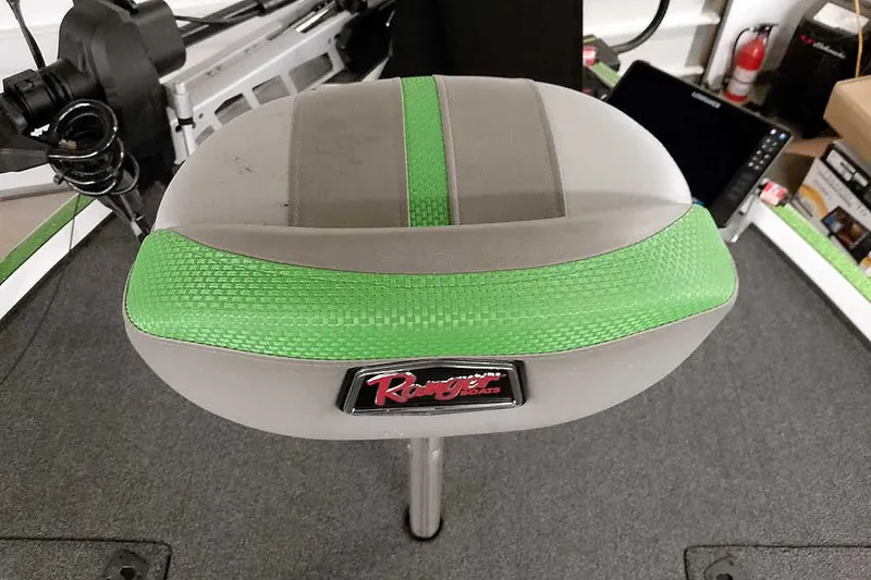 Slide: The Image of Ranger Z520R 2025 boat seat with green accents and logo, interior view. - 22