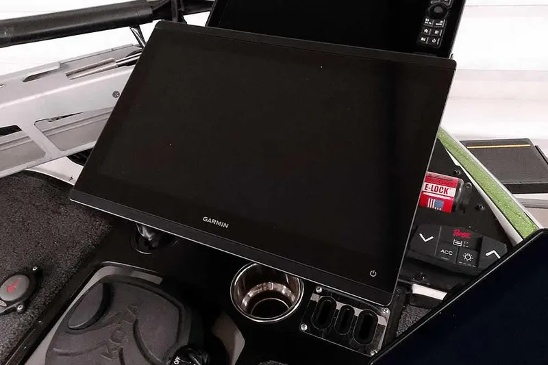 Slide: The Image of 2025 Ranger Z520R boat dashboard with Garmin display and control panel. - 25