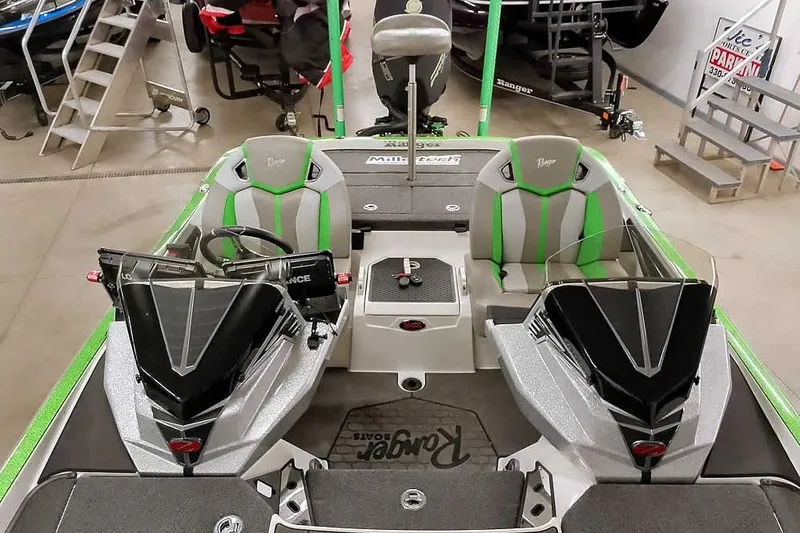 Slide: The Image of 2025 Ranger Z520R boat interior with dual seats and modern dashboard. - 27