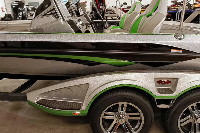Slide: The Image of 2025 Ranger Z520R boat with sleek design, green accents, and modern interior. - 3