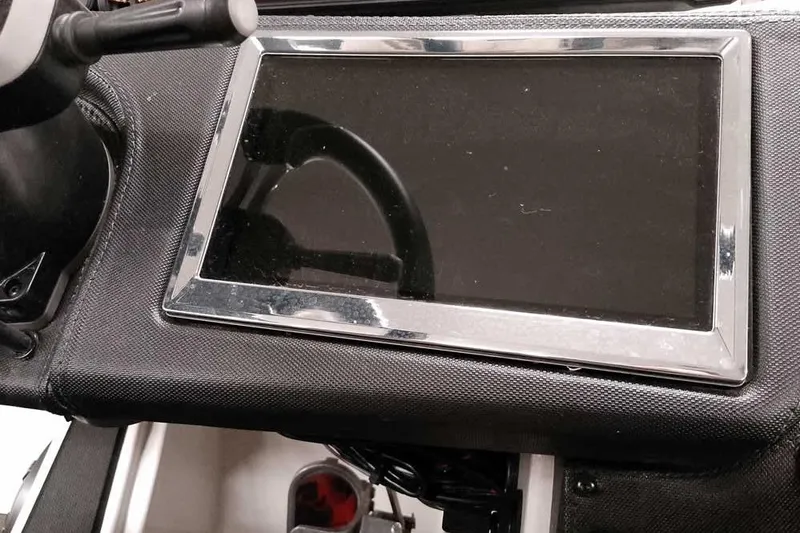 Slide: The Image of Dashboard of 2025 Ranger Z520R boat with touchscreen display and steering wheel. - 35