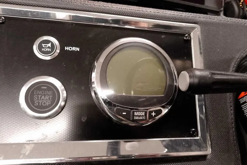 Slide: The Image of Control panel of 2025 Ranger Z520R with horn and engine start-stop buttons. - 36