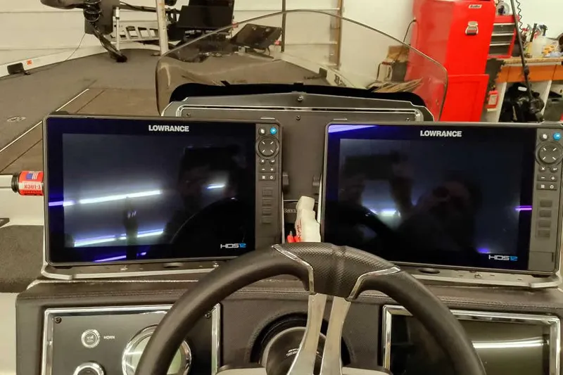 Slide: The Image of Dual Lowrance HDS12 displays on 2025 Ranger Z520R boat dashboard. - 37