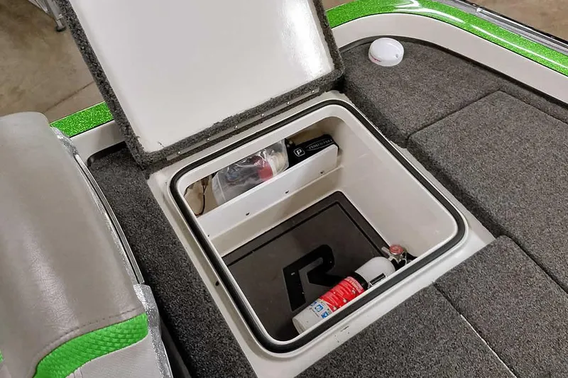 Slide: The Image of 2025 Ranger Z520R boat storage compartment with fire extinguisher and safety equipment. - 41