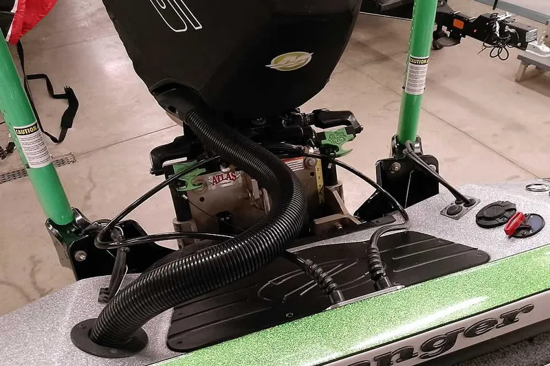 Slide: The Image of 2025 Ranger Z520R boat engine and controls in a garage setting. - 45