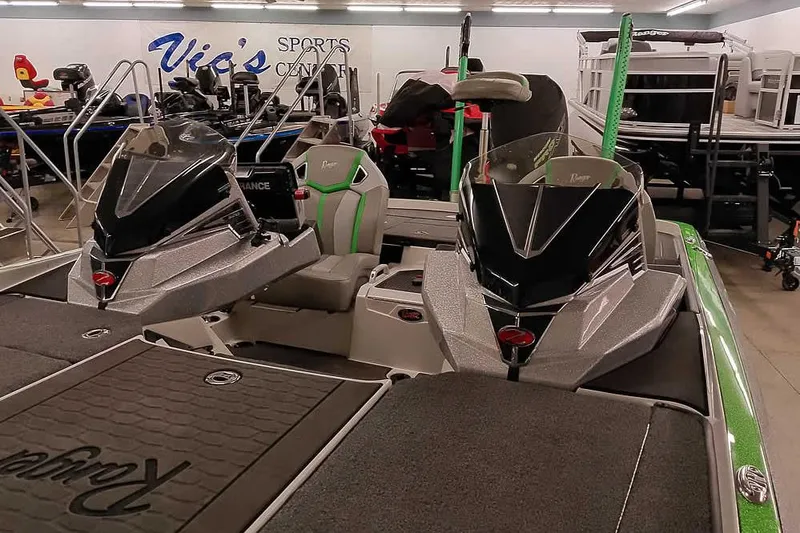 Slide: The Image of 2025 Ranger Z520R boat displayed indoors at Vic's Sports Center. - 9