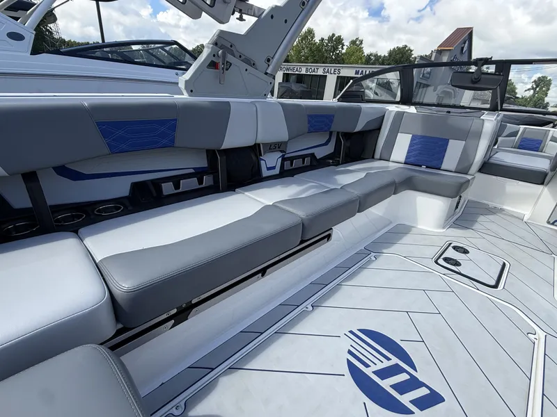 Slide: The Image of Interior of 2022 Malibu Wakesetter 25 LSV with gray and blue seating. - 12
