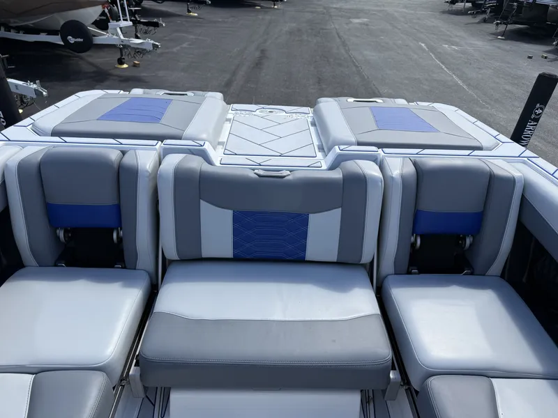 Slide: The Image of Interior of 2022 Malibu Wakesetter 25 LSV with gray and blue seating. - 13
