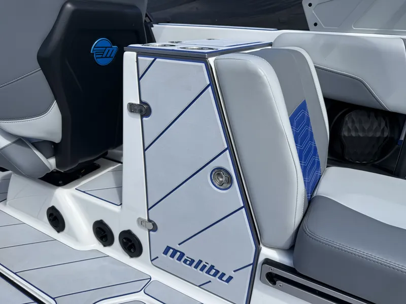 Slide: The Image of Interior of 2022 Malibu Wakesetter 25 LSV with gray and blue seating. - 15