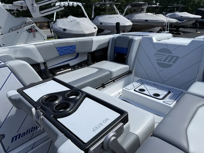 Slide: The Image of Interior of 2022 Malibu Wakesetter 25 LSV with luxurious seating. - 17