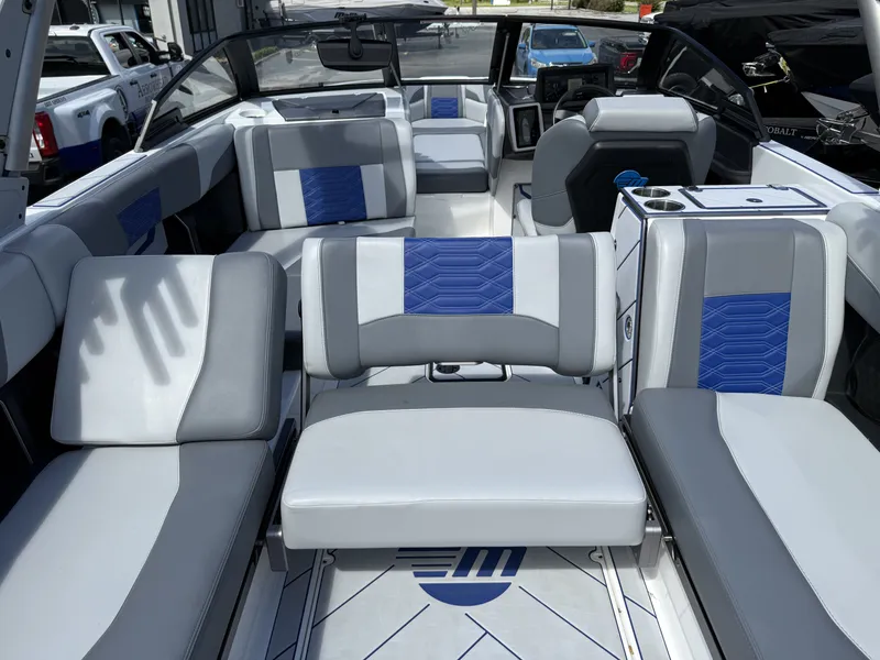 Slide: The Image of Interior of 2022 Malibu Wakesetter 25 LSV with blue and gray seating. - 18