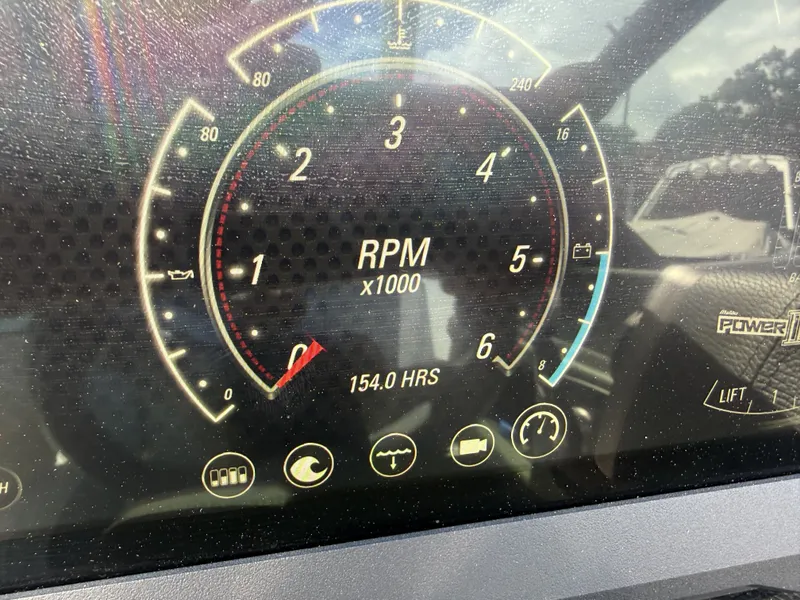 Slide: The Image of 2022 Malibu Wakesetter 25 LSV tachometer showing 154 hours. - 23