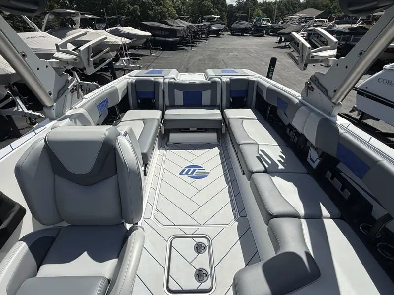 Slide: The Image of Interior of 2022 Malibu Wakesetter 25 LSV with gray seating. - 26
