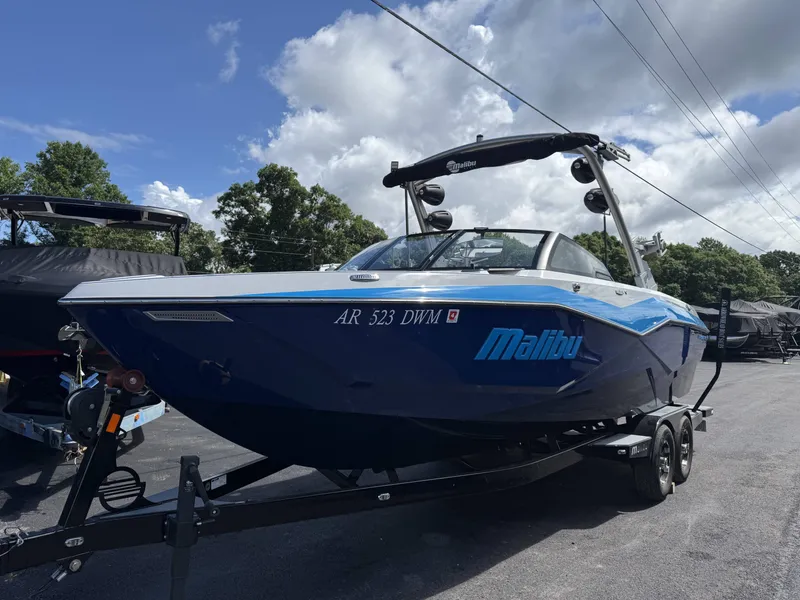 Slide: The Image of 2022 Malibu Wakesetter 25 LSV boat on trailer, blue sky. - 7