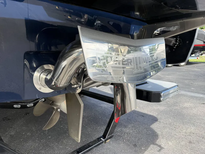 Slide: The Image of Rear view of a 2022 Malibu Wakesetter 25 LSV with propeller. - 8