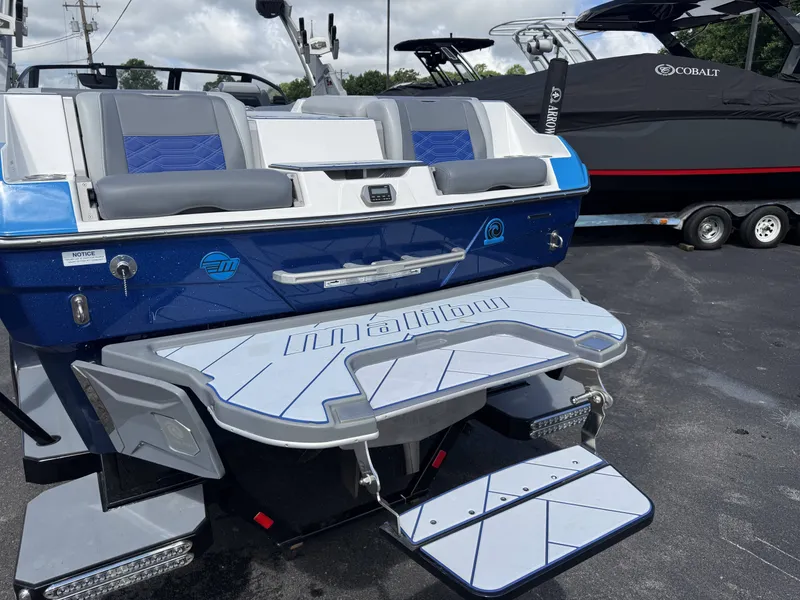 Slide: The Image of 2022 Malibu Wakesetter 25 LSV boat with luxurious rear design. - 9