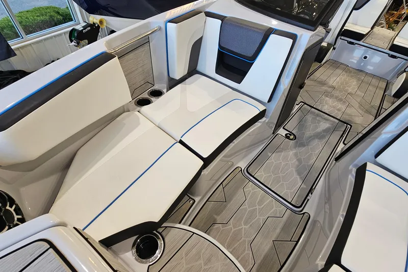 Slide: The Image of 2023 Yamaha Boats 222XD interior with sleek seating and modern flooring design. - 19