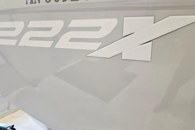 Slide: The Image of 2023 Yamaha Boats 222XD logo on sleek gray surface. - 24