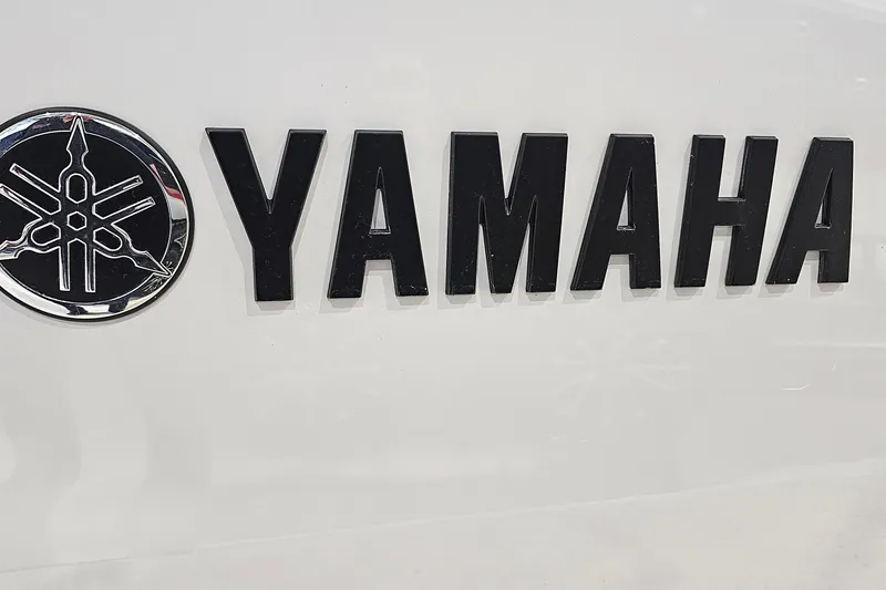 Slide: The Image of Yamaha logo on 2023 Yamaha Boats 222XD, featuring bold black lettering and emblem. - 26