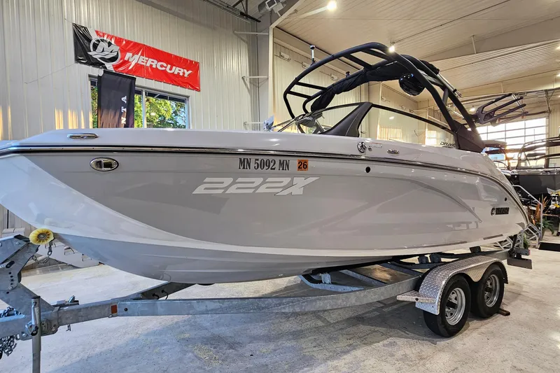 Slide: The Image of 2023 Yamaha Boats 222XD on trailer in showroom, featuring sleek design and modern features. - 3