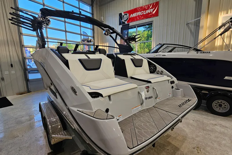 Slide: The Image of 2023 Yamaha Boats 222XD in showroom, featuring sleek design and modern amenities. - 4