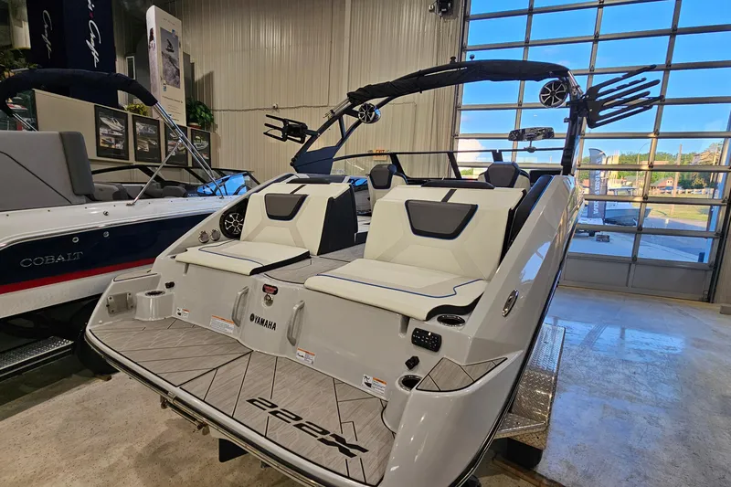 Slide: The Image of 2023 Yamaha Boats 222XD in showroom, showcasing sleek design and modern features. - 5