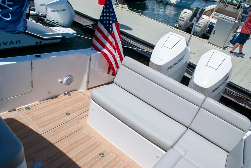 Slide: The Image of The image shows the stern of a 2027 MJM Yachts 38R with two Mercury outboard engines. - 9